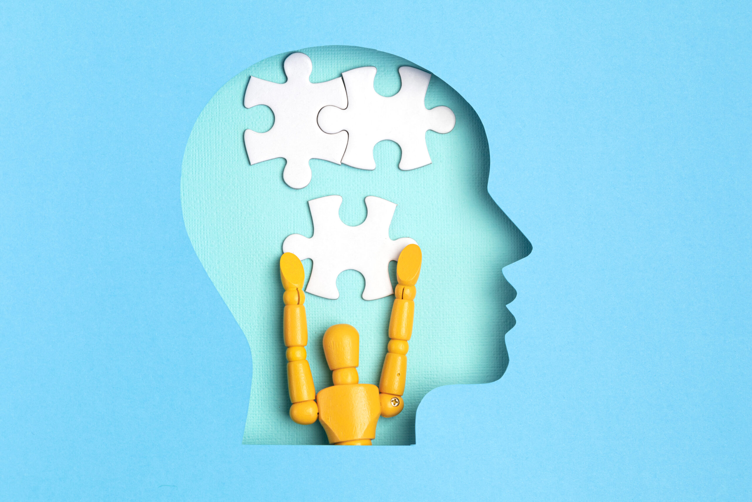 Illustration of a human head with puzzle pieces representing understanding mental health treatment progress